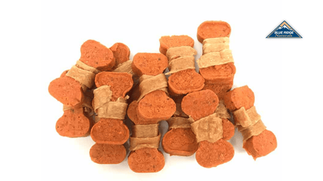 Pile of Blue Ridge Naturals' Chicken Wrapped Sweet Potato Bones for dogs