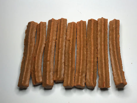 Pile of Peanut Butter Coated Sweet Tater Stix dog treats